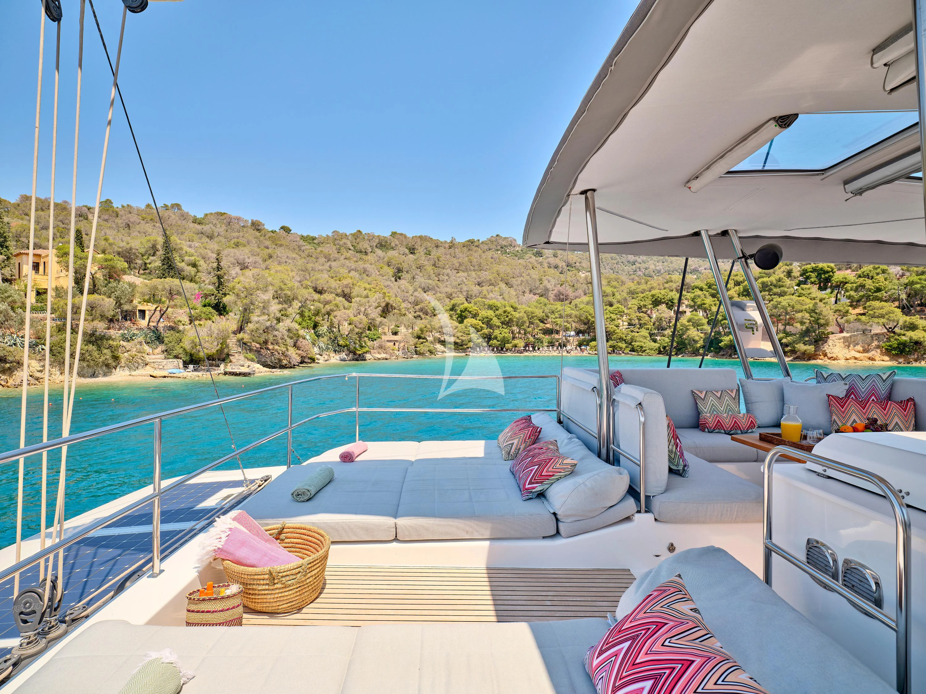 a pool with a view of the mountains and trees aboard KIMATA Yacht for Charter