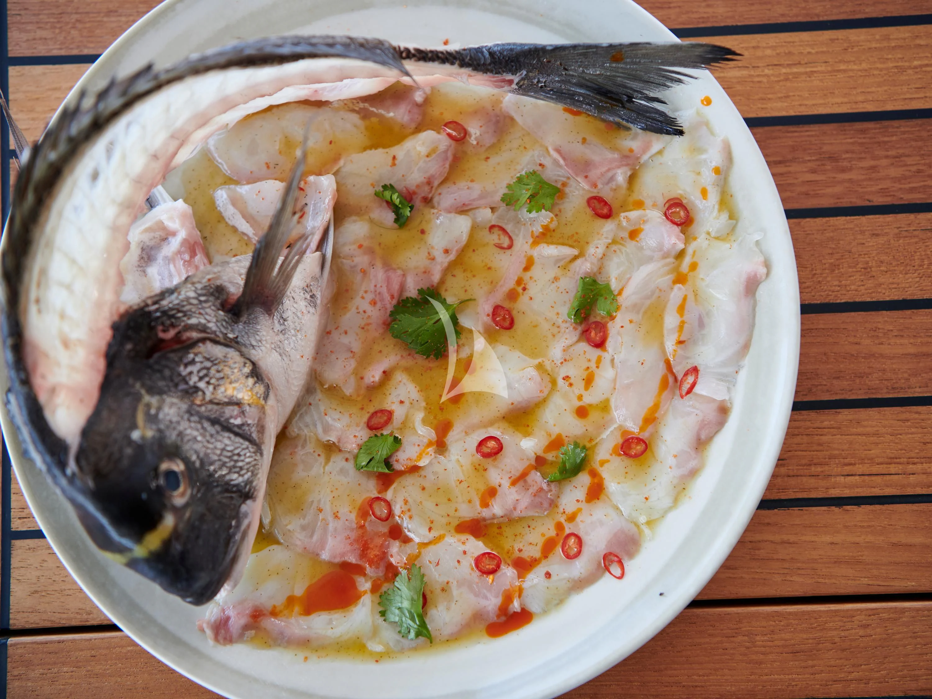 a plate of food aboard KIMATA Yacht for Charter