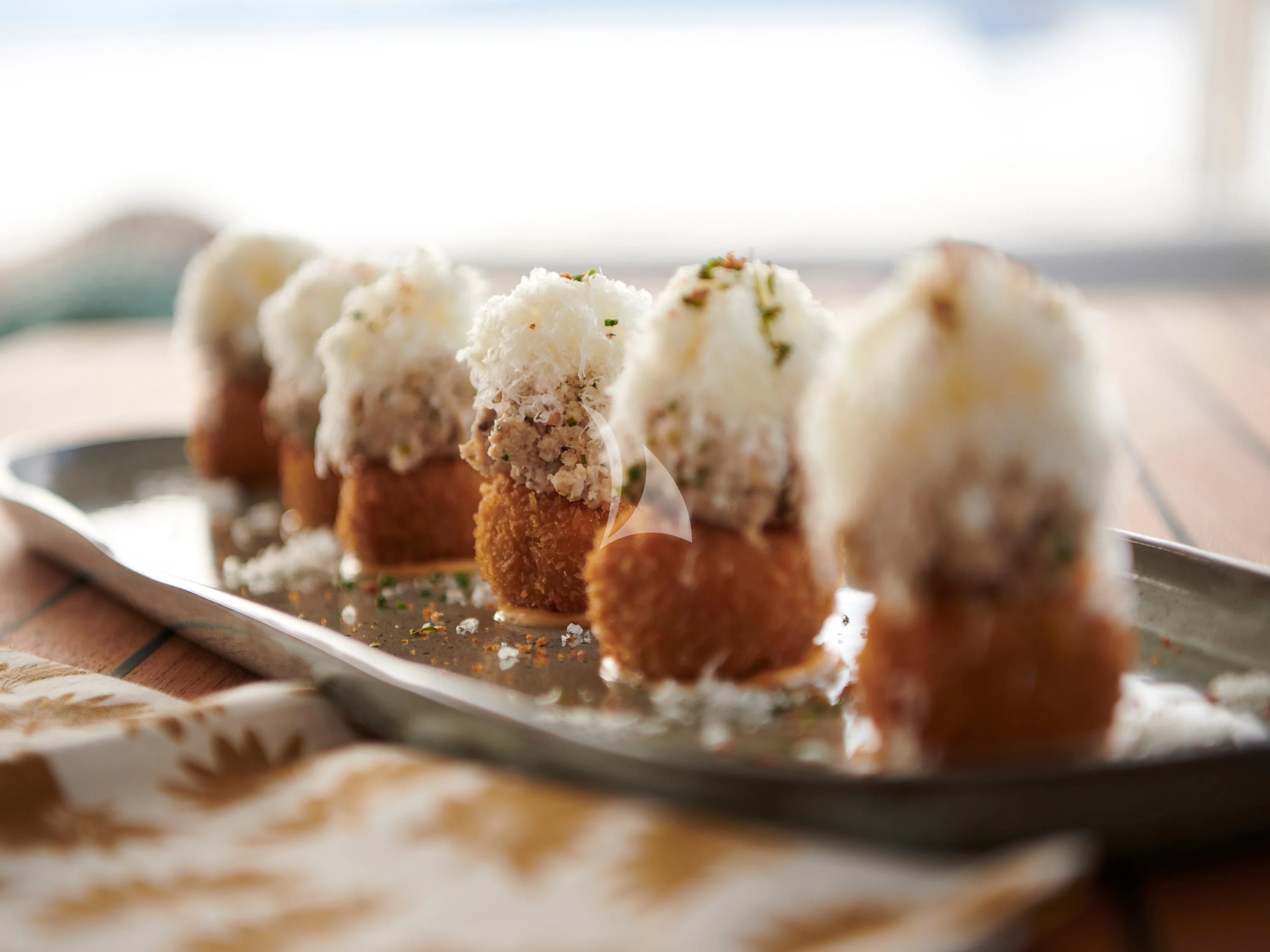 a plate of food aboard KIMATA Yacht for Charter