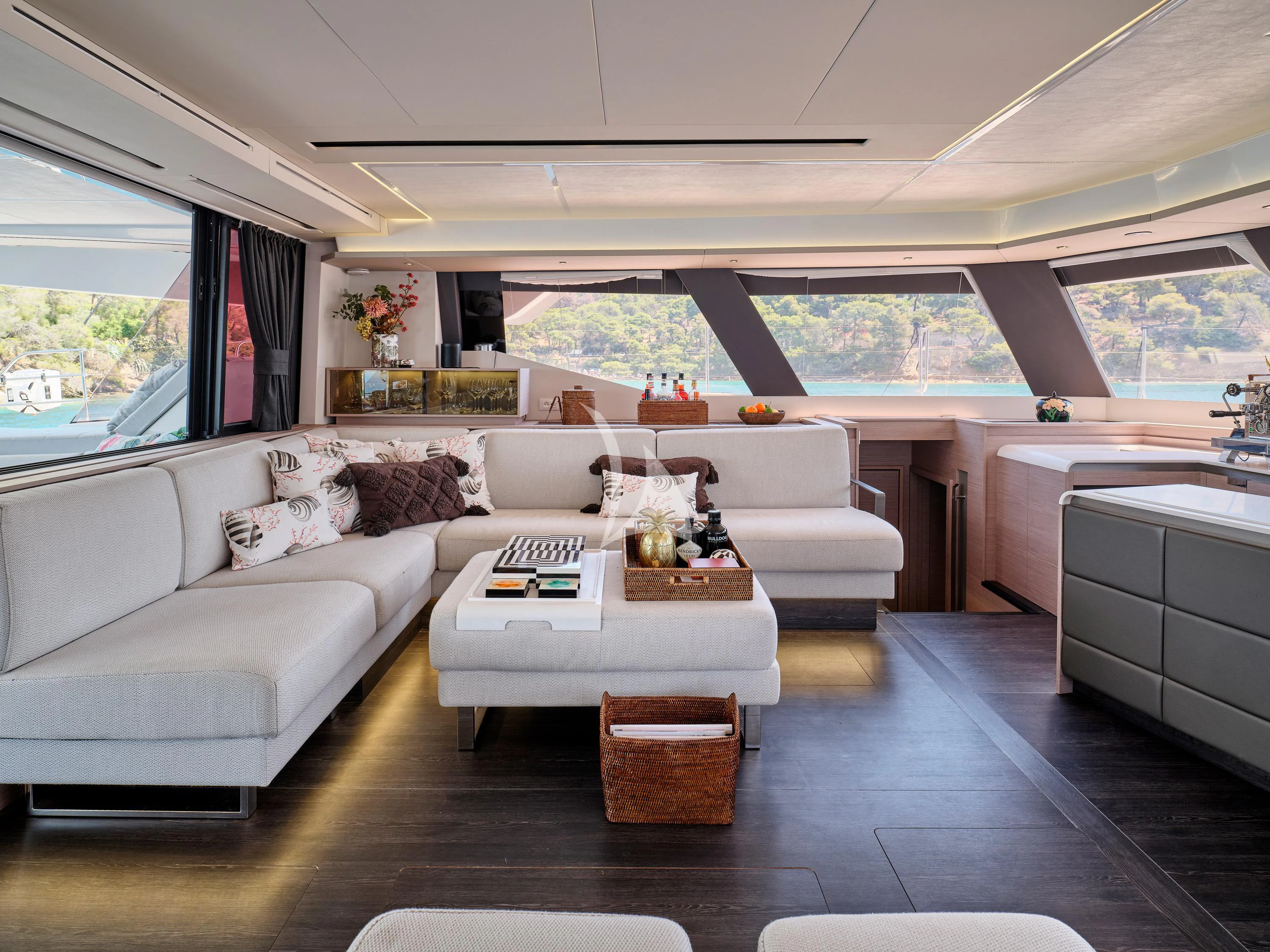 a living room with a couch and a table aboard KIMATA Yacht for Charter