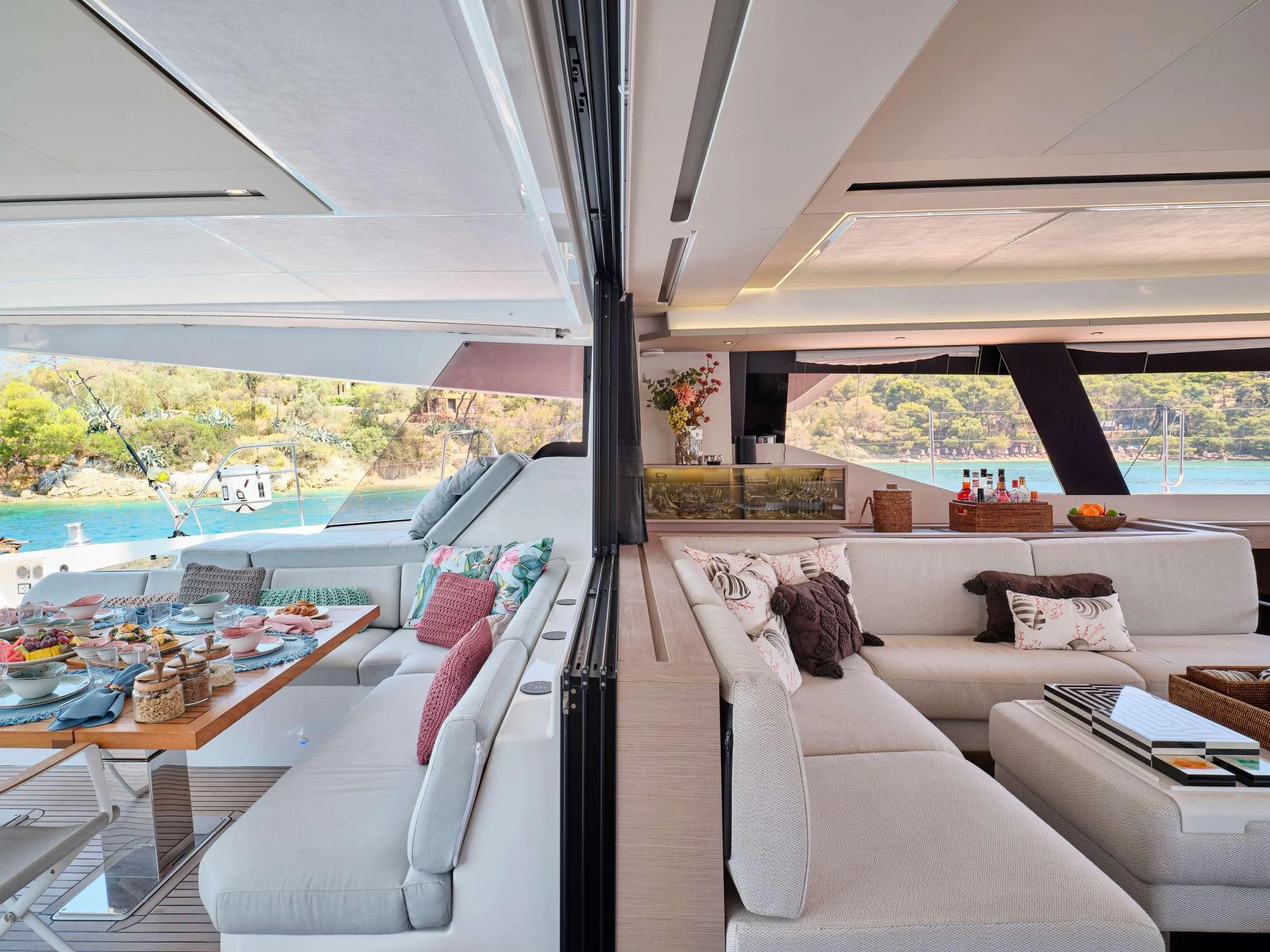 a living room with a large window aboard KIMATA Yacht for Charter