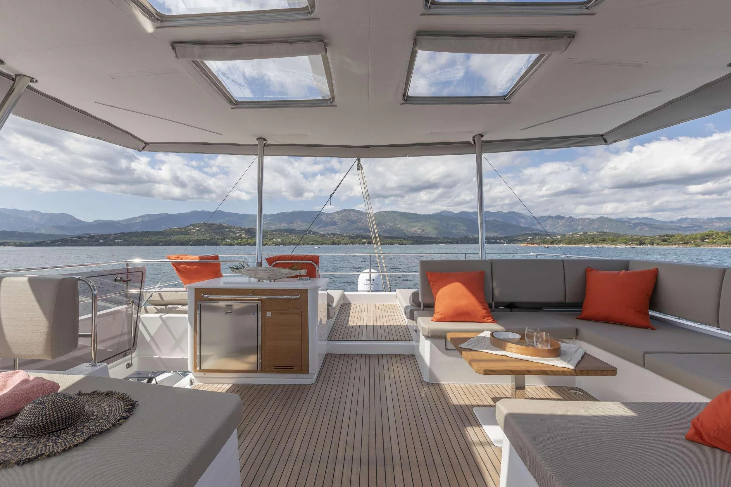 a room with a couch and a table and chairs aboard KIMATA Yacht for Charter