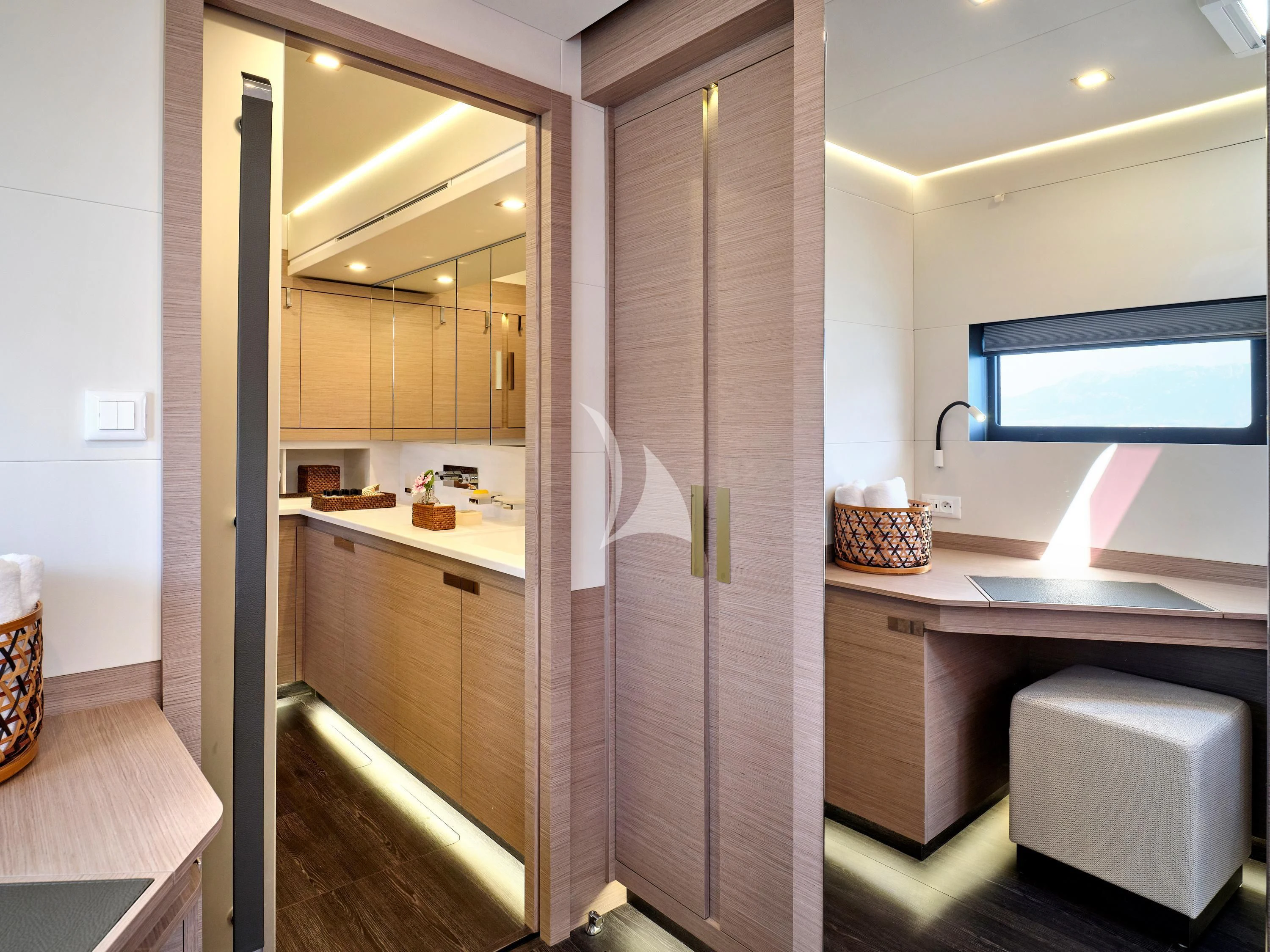 a bathroom with a sink and a mirror aboard KIMATA Yacht for Charter