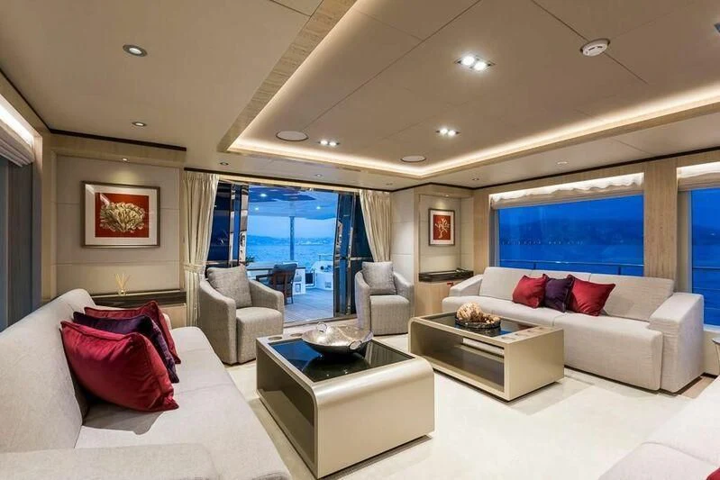 a living room with a large window aboard KRISHH Yacht for Sale