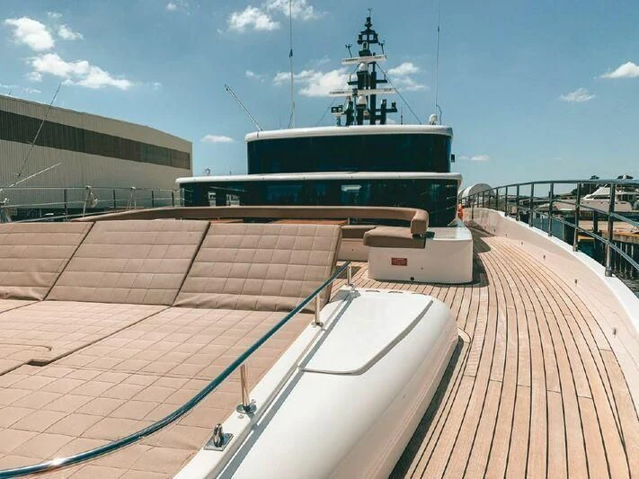 a deck with a ship in the water aboard KRISHH Yacht for Sale