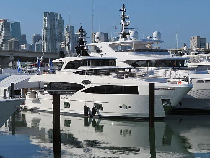 a couple of boats are parked in a harbor aboard KRISHH Yacht for Sale
