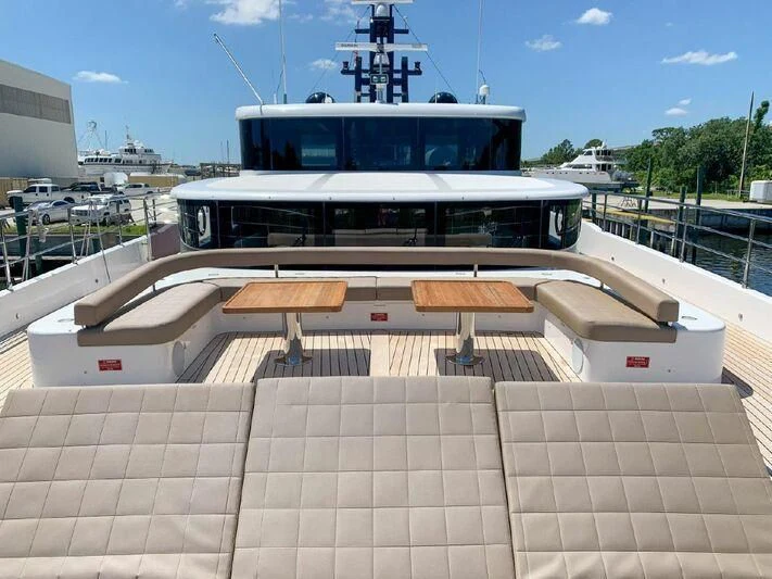 a large white boat in a harbor aboard KRISHH Yacht for Sale