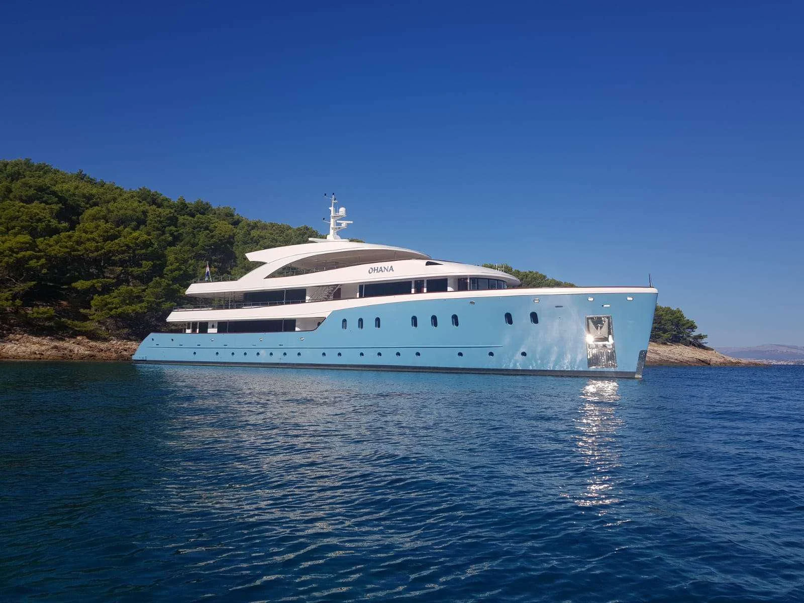 a white boat in the water aboard OHANA Yacht for Sale