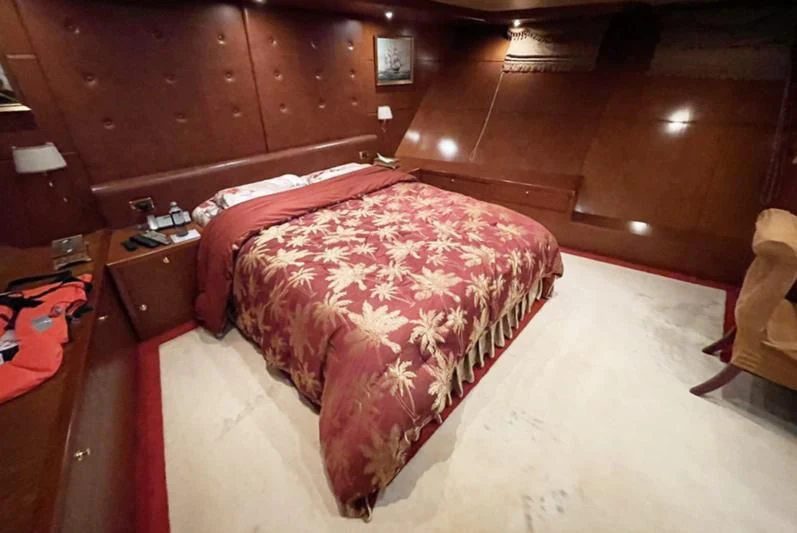 a bed in a room aboard NASAYEM Yacht for Sale