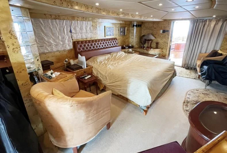 a room with a couple of beds aboard NASAYEM Yacht for Sale