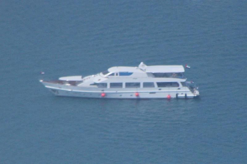 a white boat in the water aboard NASAYEM Yacht for Sale