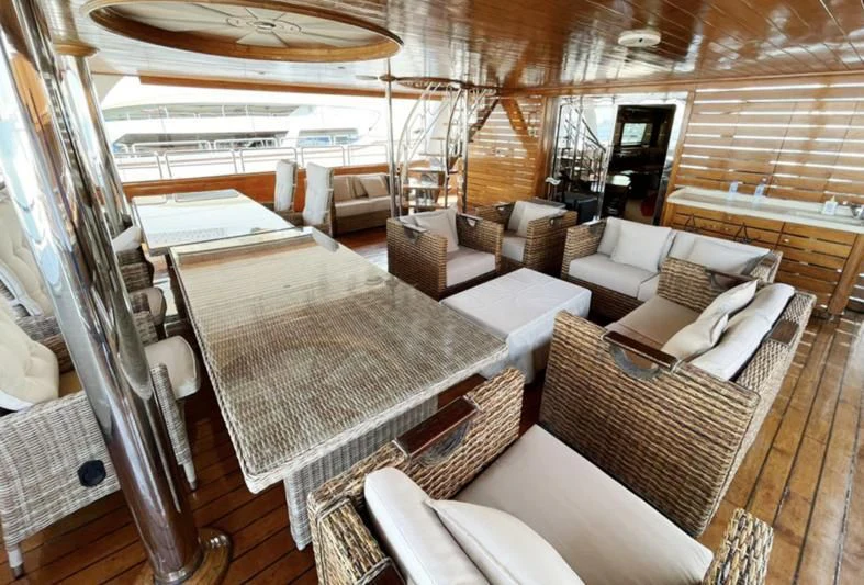 a room with a couch and a table aboard NASAYEM Yacht for Sale