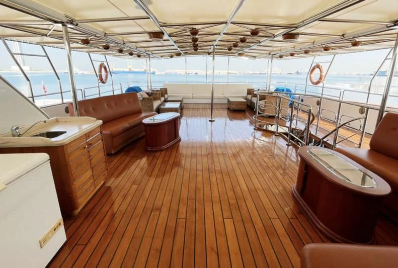 a boat with a wood deck aboard NASAYEM Yacht for Sale