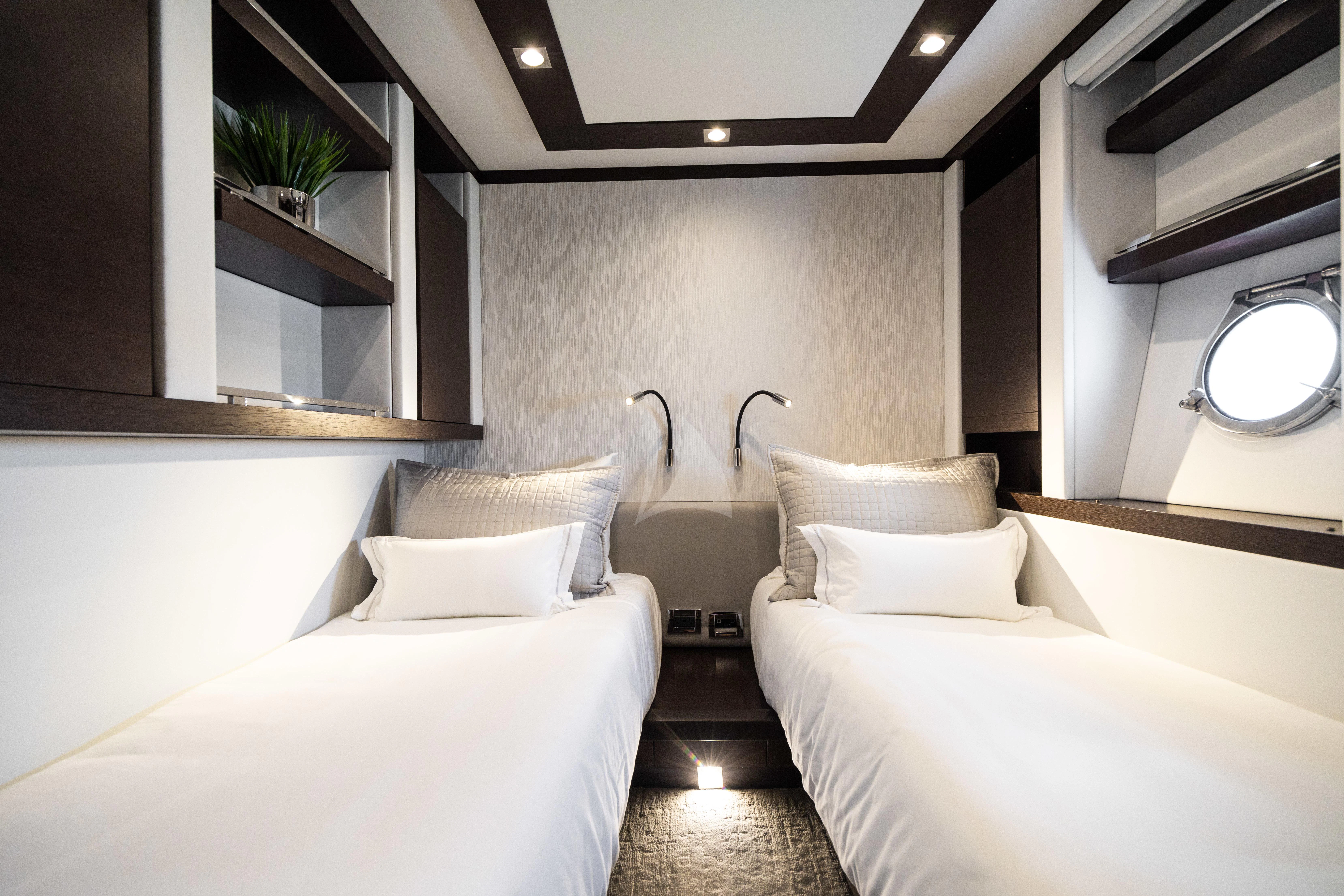 a room with a bed and a mirror aboard M Yacht for Charter