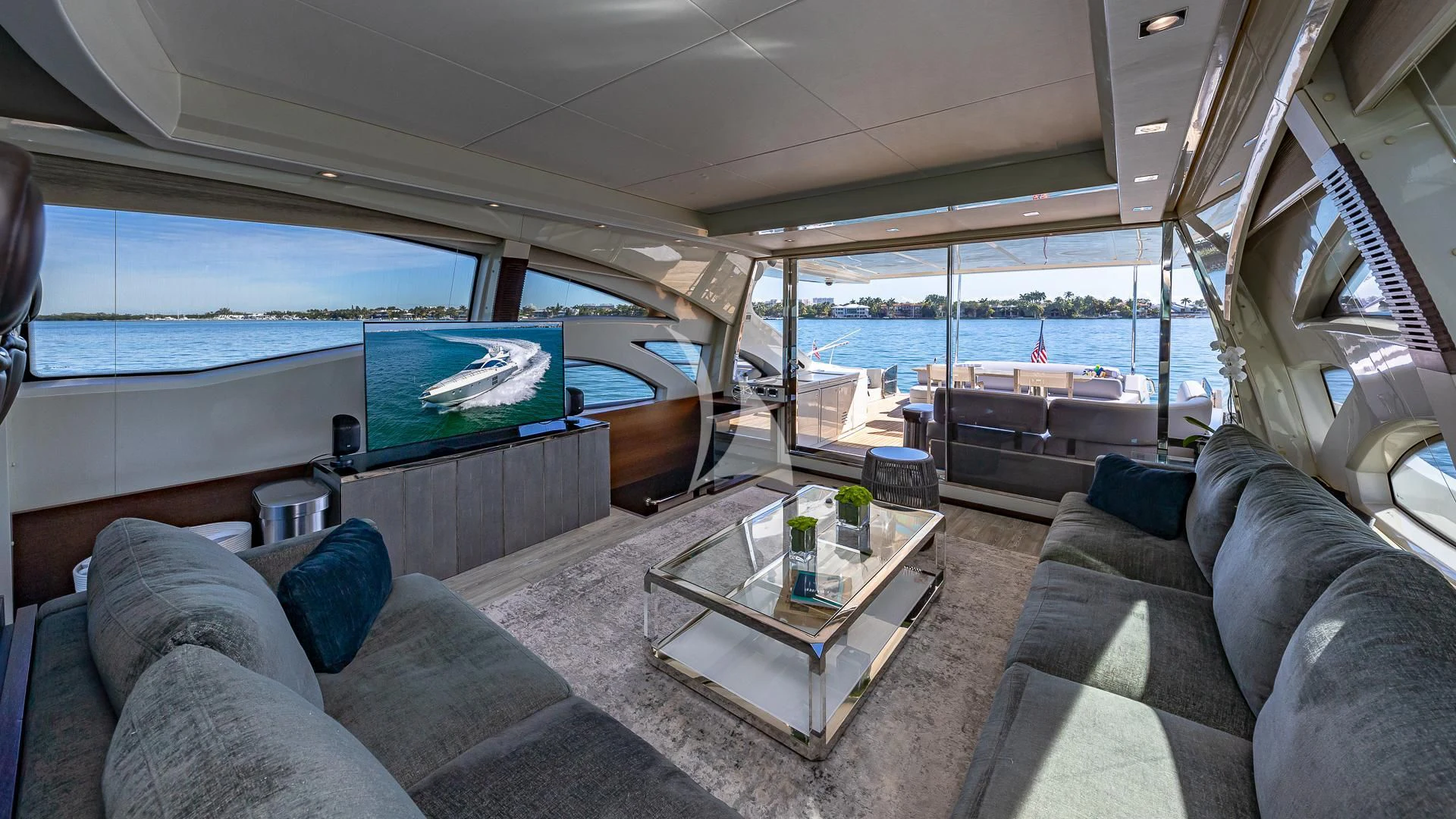 a living room with a large window aboard M Yacht for Charter