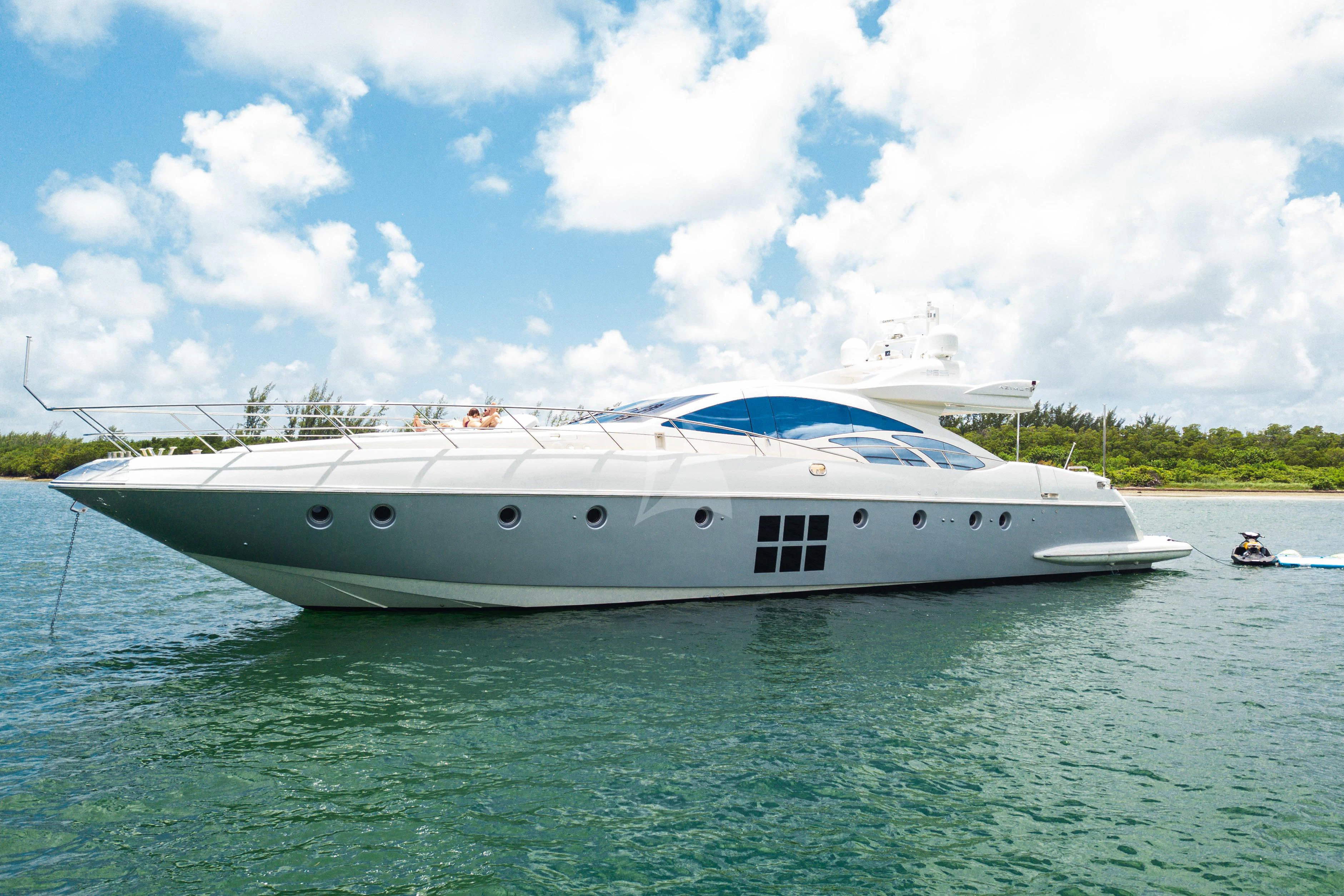 a white yacht in the water aboard M Yacht for Charter
