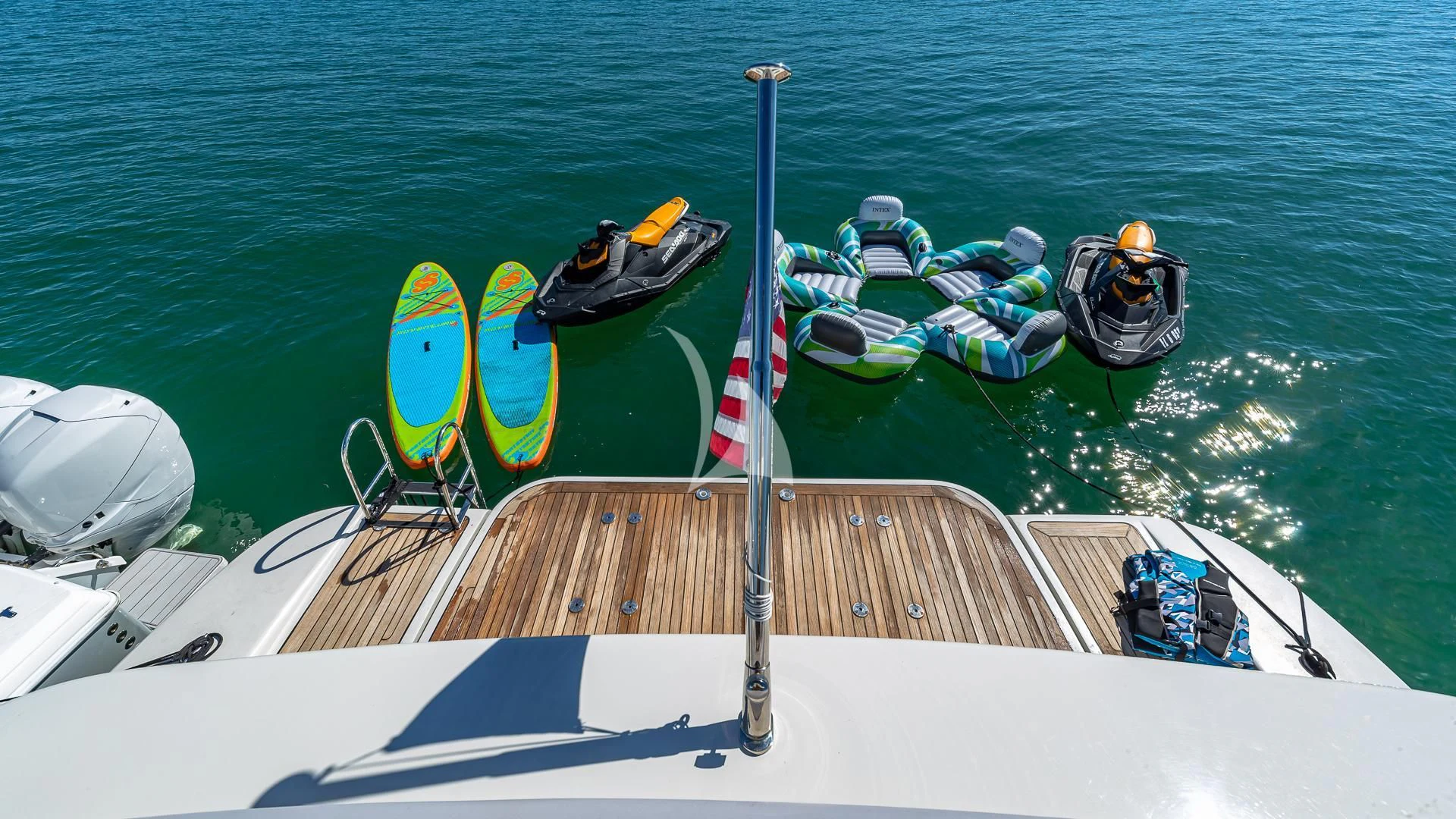 a boat with paddles and boats on the water aboard M Yacht for Charter