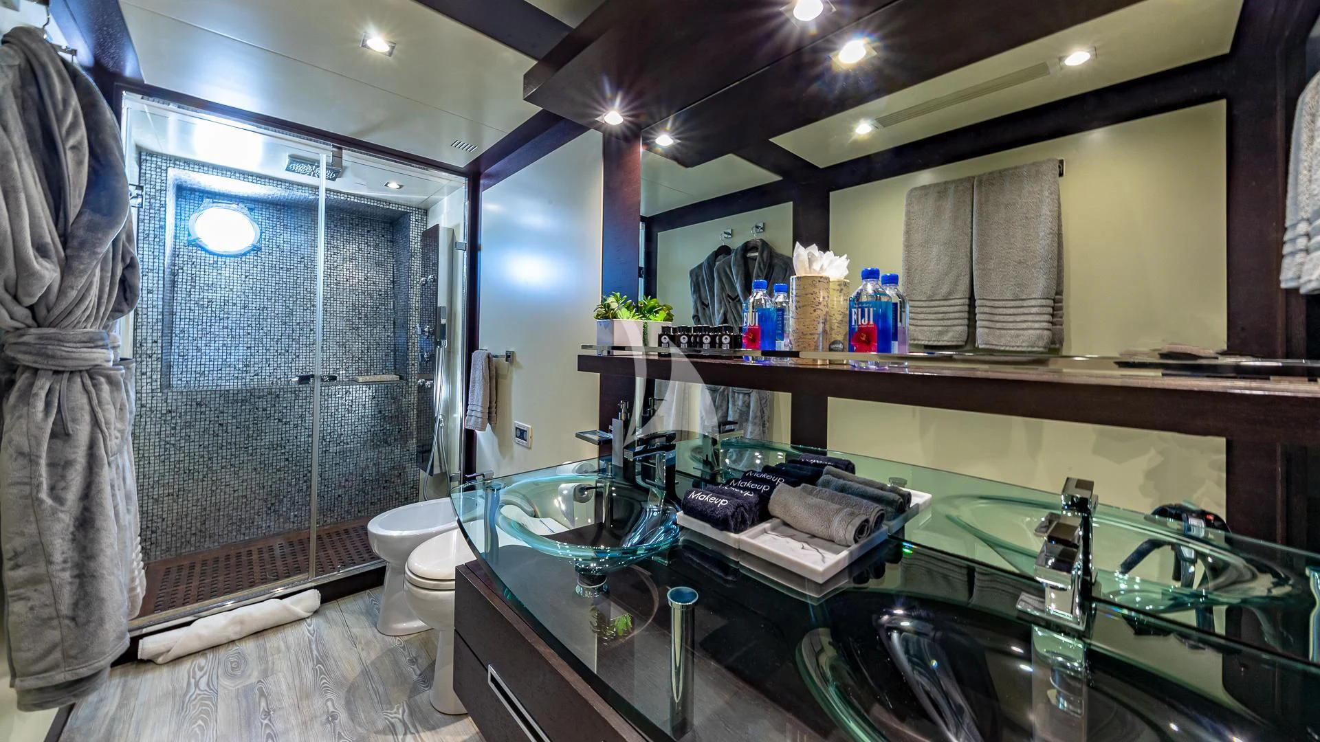 a bathroom with a sink and a shower aboard M Yacht for Charter