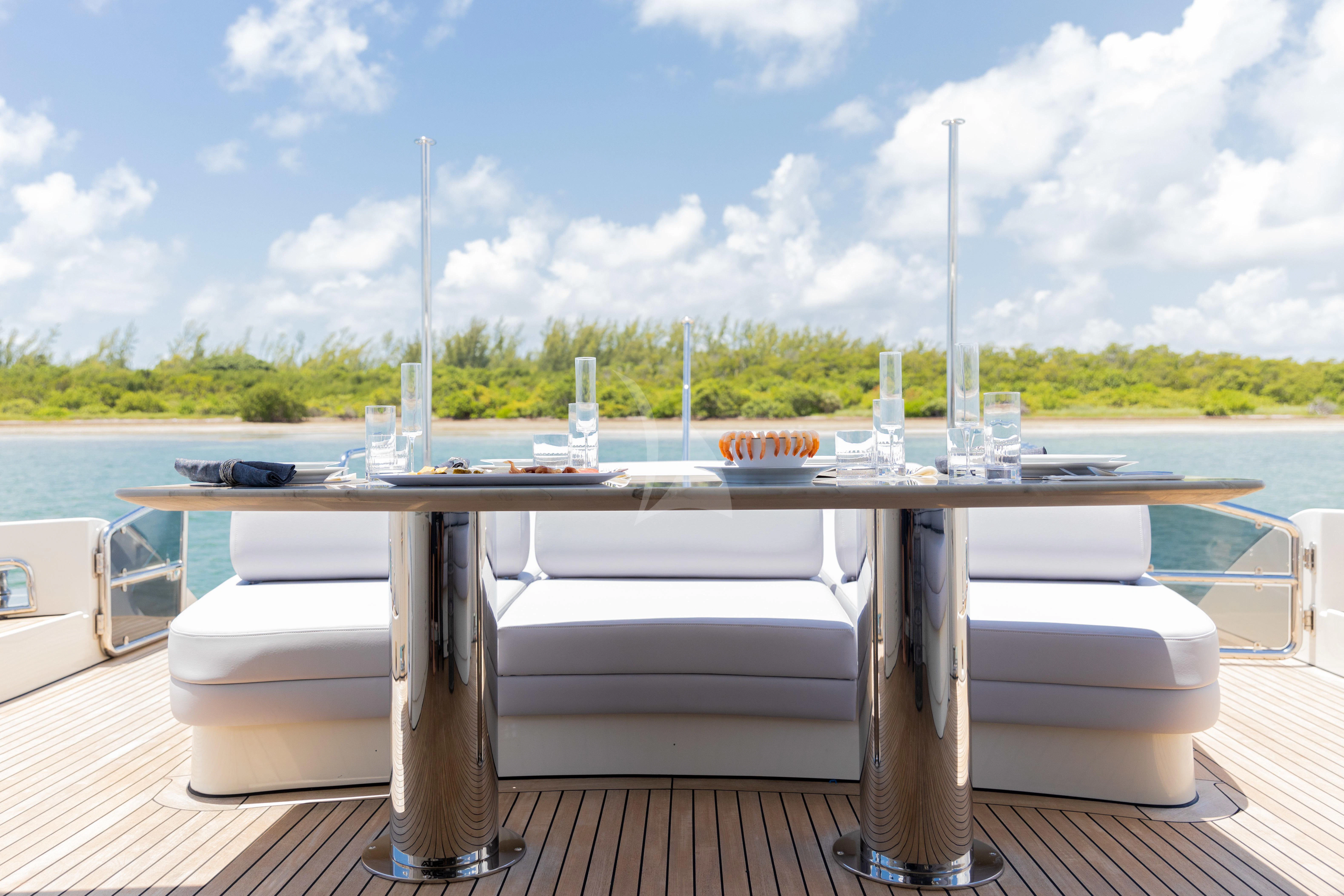 a table with glasses on it aboard M Yacht for Charter