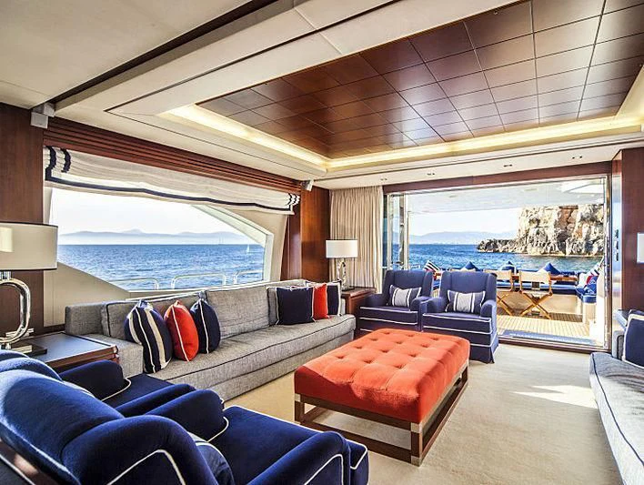 a living room with a large window aboard W1 Yacht for Sale
