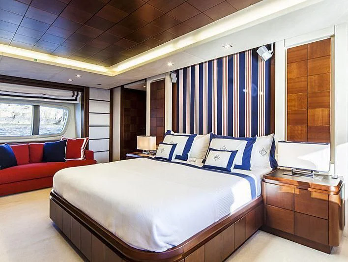 a large bedroom with a large bed aboard W1 Yacht for Sale