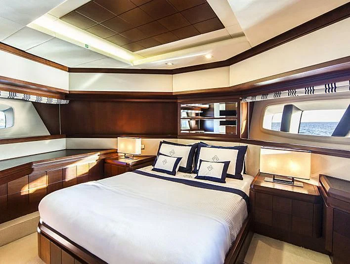 a room with a bed and a window aboard W1 Yacht for Sale