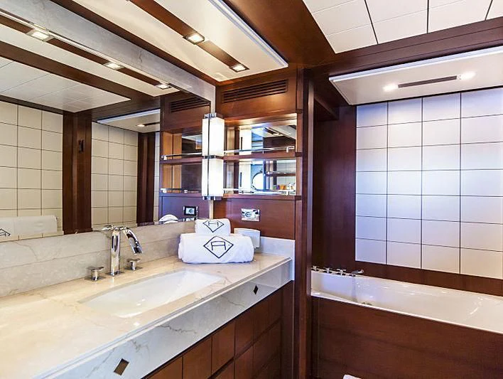 a bathroom with a sink and a mirror aboard W1 Yacht for Sale