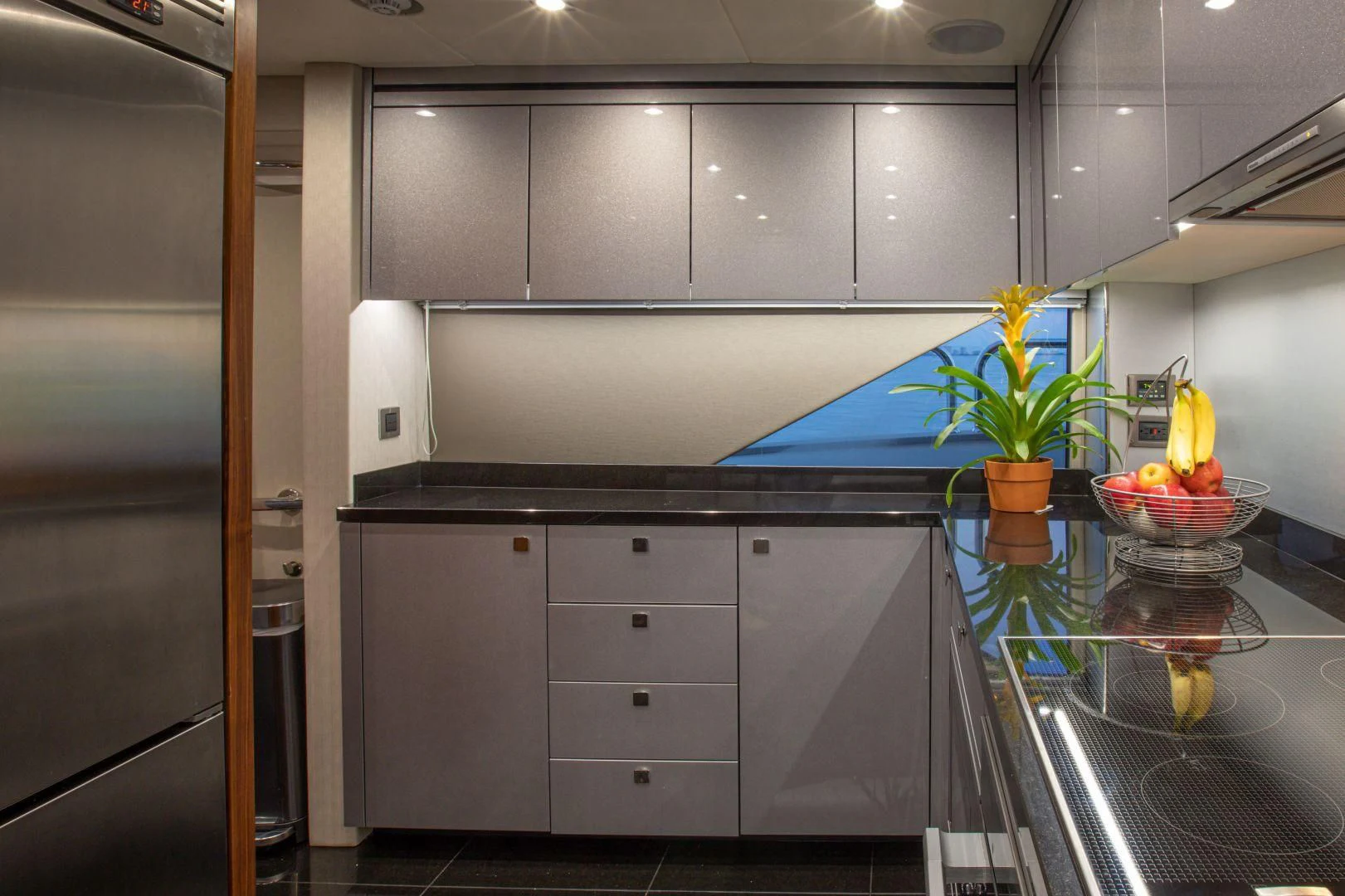 a kitchen with a glass counter top aboard JUST ONE MORE Yacht for Sale
