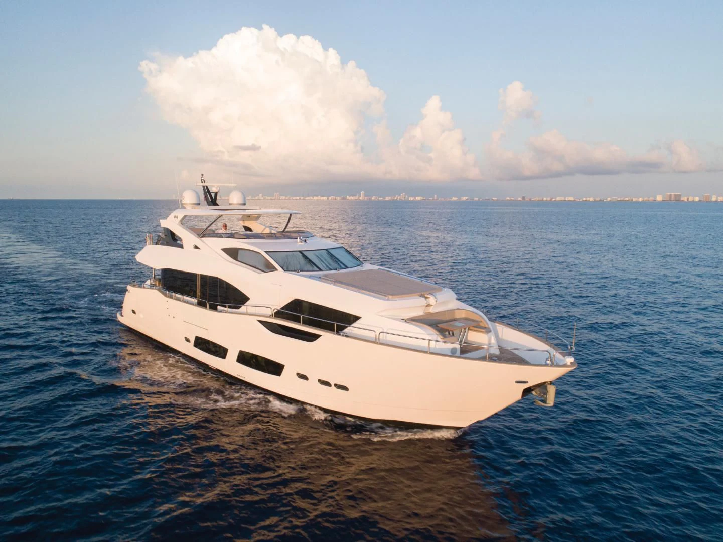 a white yacht on the water aboard JUST ONE MORE Yacht for Sale