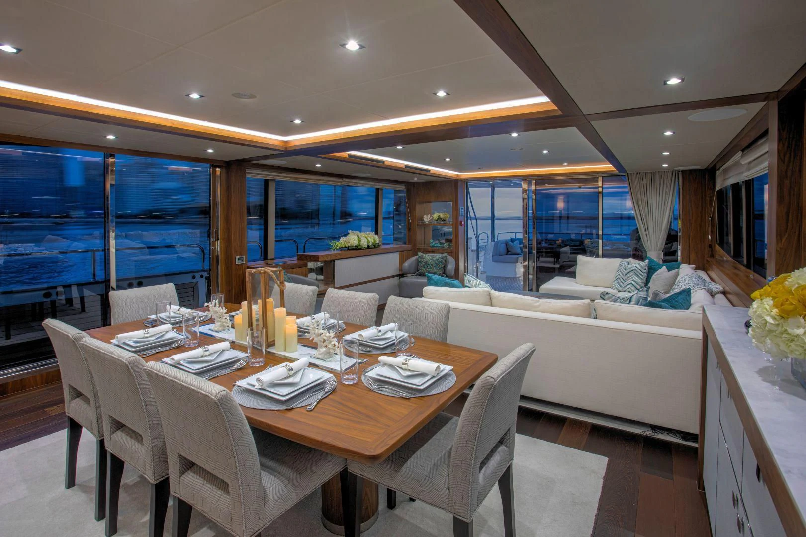 a dining room with a large window aboard JUST ONE MORE Yacht for Sale