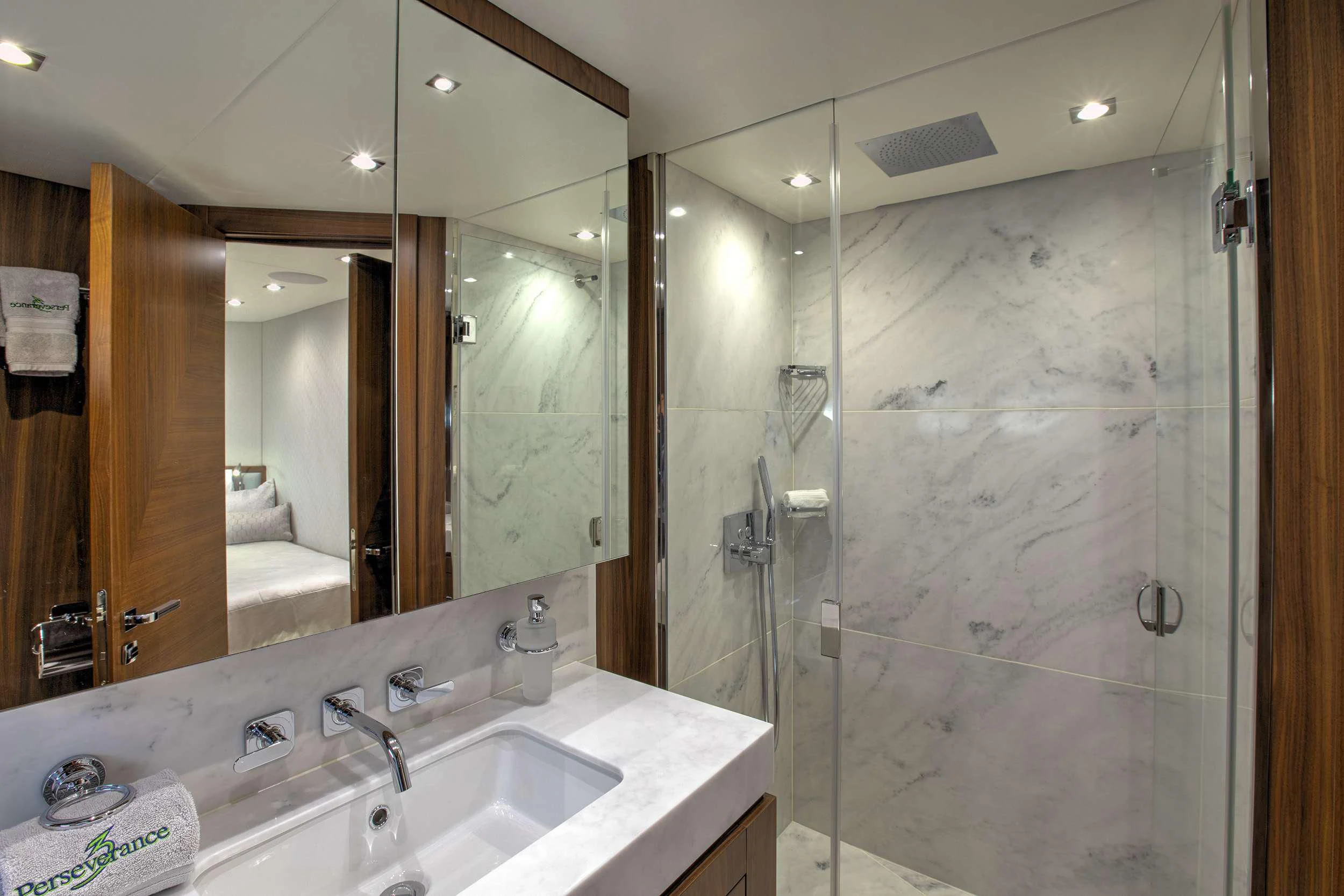 a bathroom with a glass shower aboard JUST ONE MORE Yacht for Sale