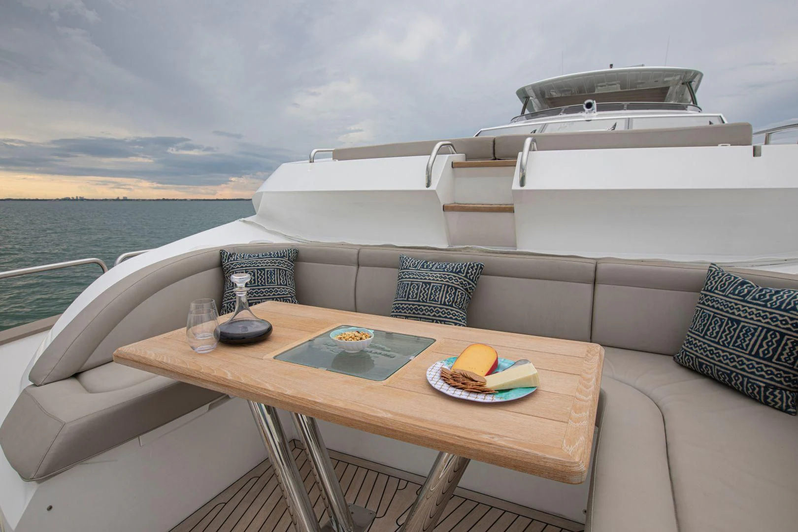 a couch with a table on it aboard JUST ONE MORE Yacht for Sale