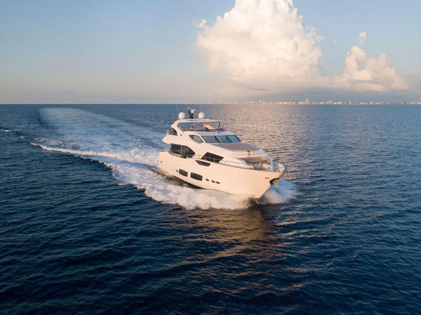 a white yacht on the water aboard JUST ONE MORE Yacht for Sale