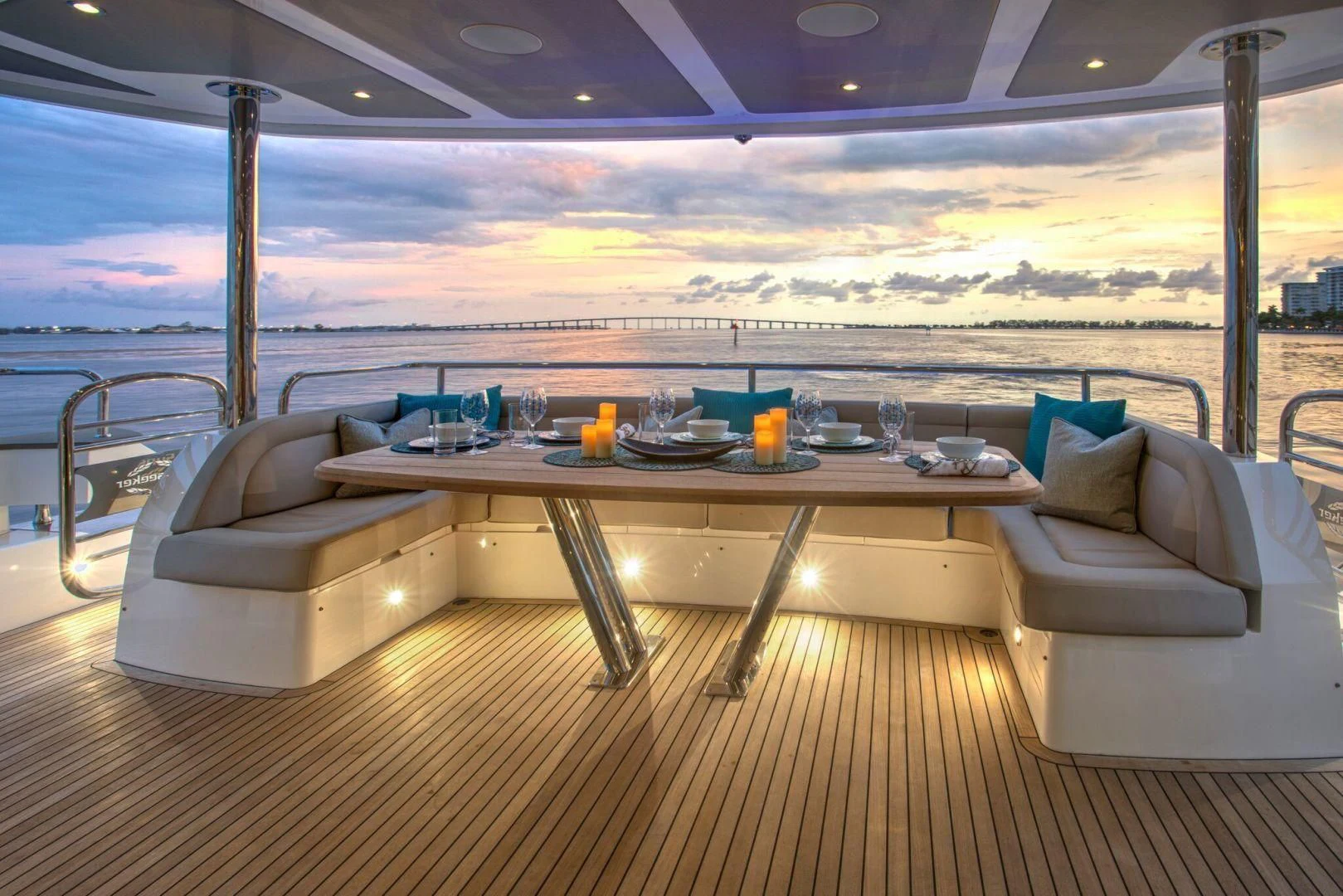 a table with chairs and a couch aboard JUST ONE MORE Yacht for Sale