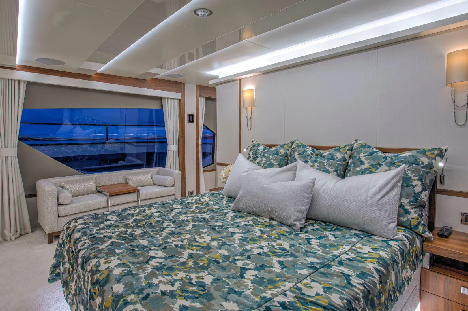 a bed with a blue comforter aboard JUST ONE MORE Yacht for Sale