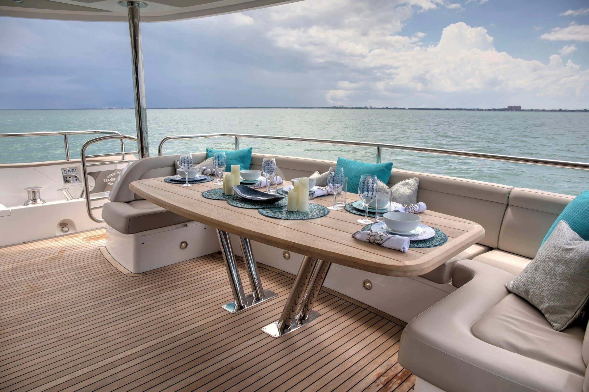 a table on a deck overlooking the ocean aboard JUST ONE MORE Yacht for Sale