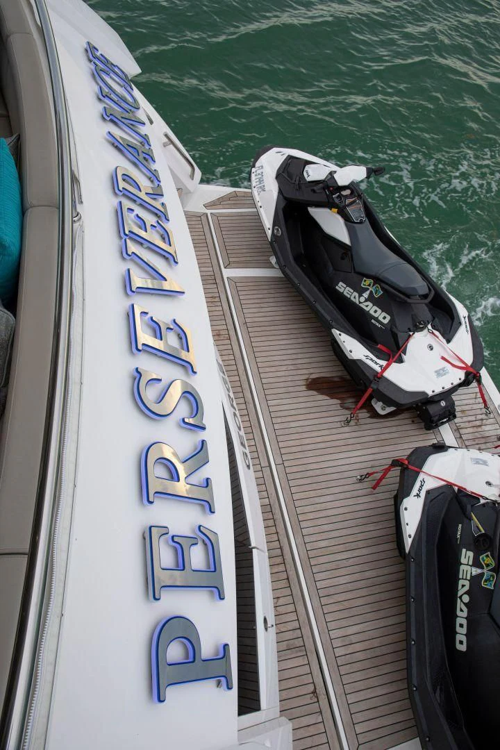 a boat with a motor on the water aboard JUST ONE MORE Yacht for Sale