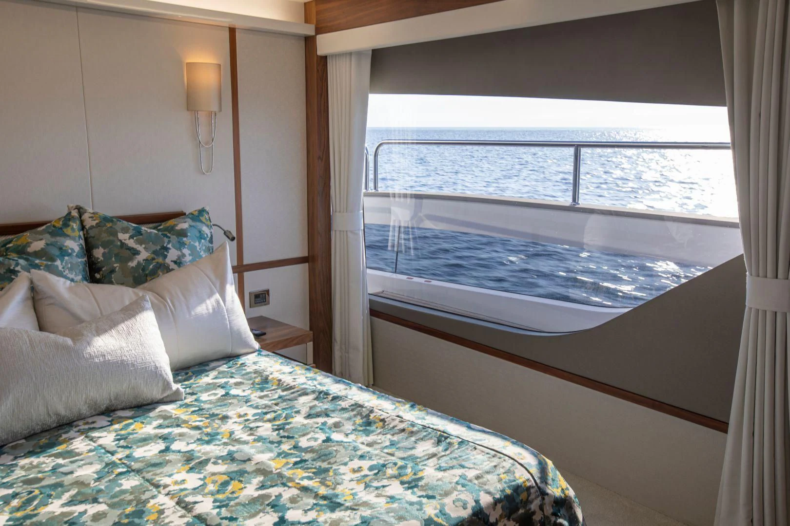 a bed with a window aboard JUST ONE MORE Yacht for Sale