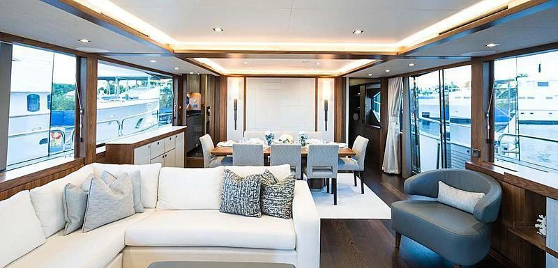 a living room with a large window aboard JUST ONE MORE Yacht for Sale