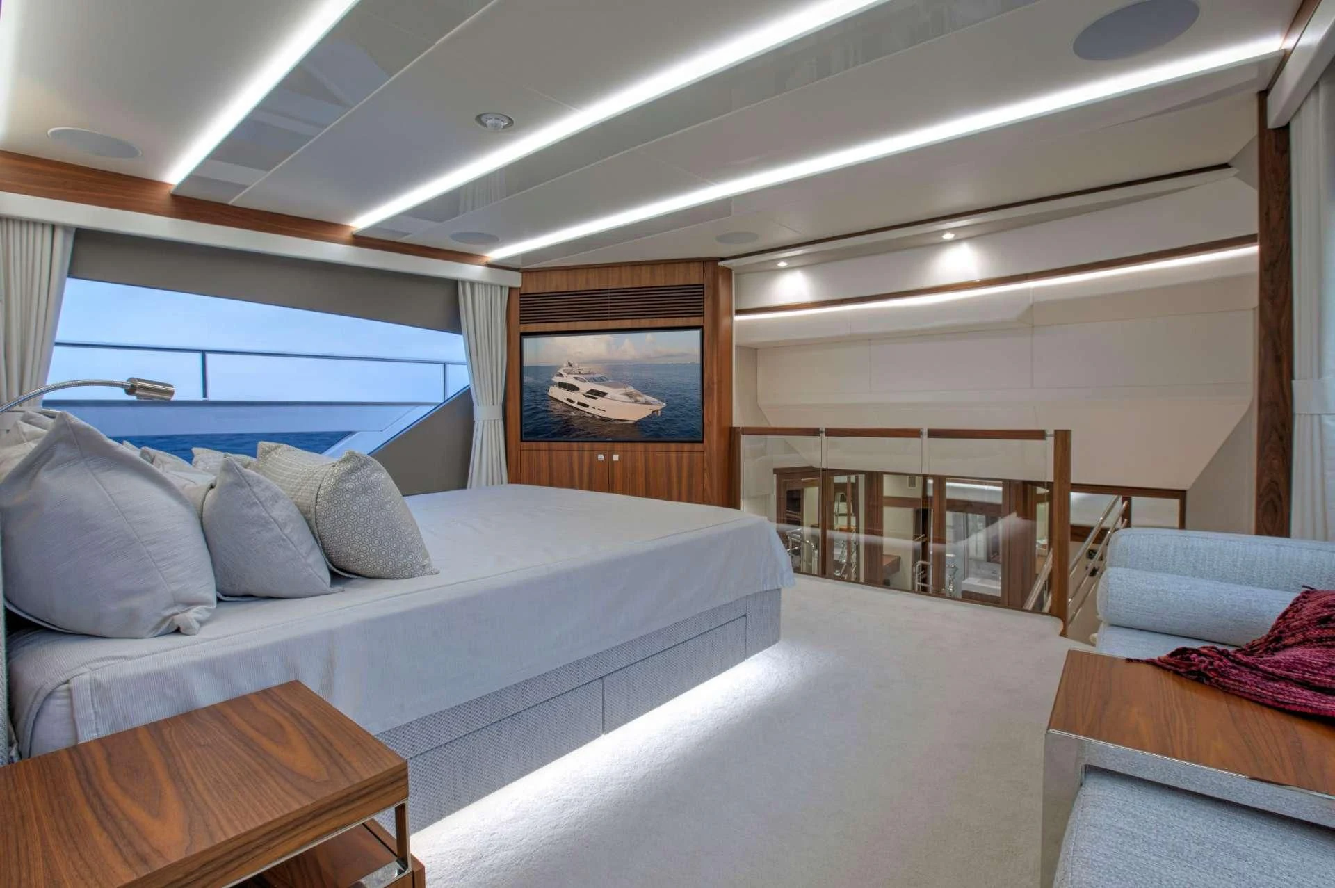 a room with a bed and a couch aboard JUST ONE MORE Yacht for Sale