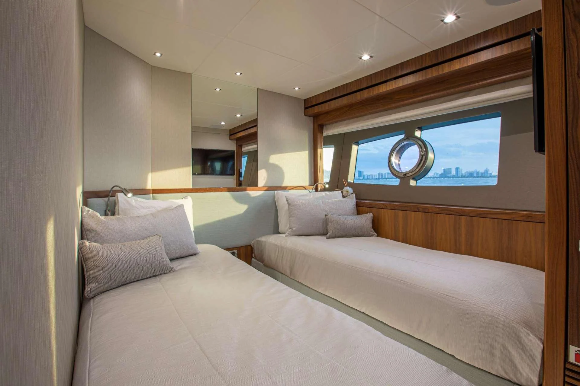 a bed with a white bed aboard JUST ONE MORE Yacht for Sale