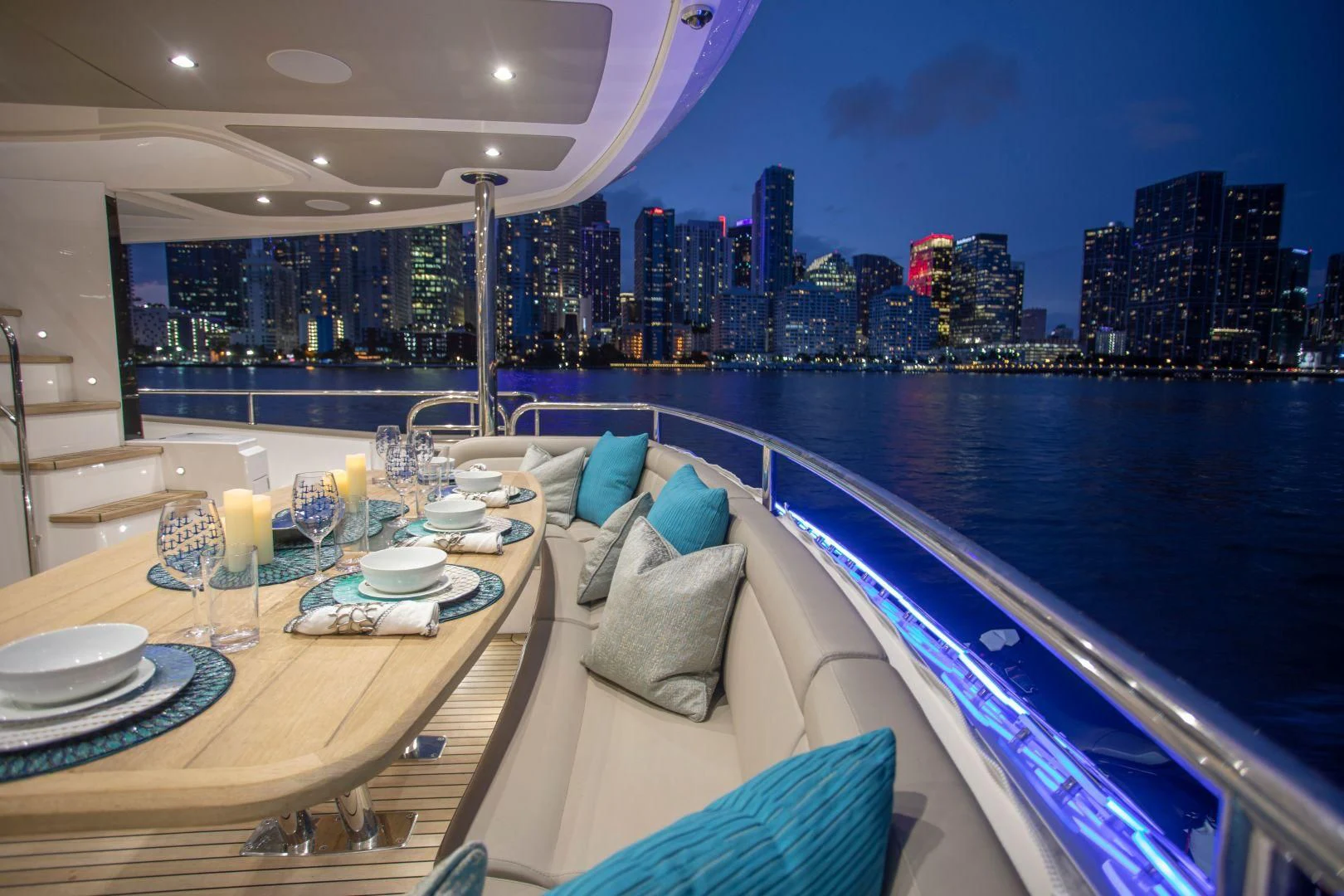 a room with a view of a city and the ocean aboard JUST ONE MORE Yacht for Sale