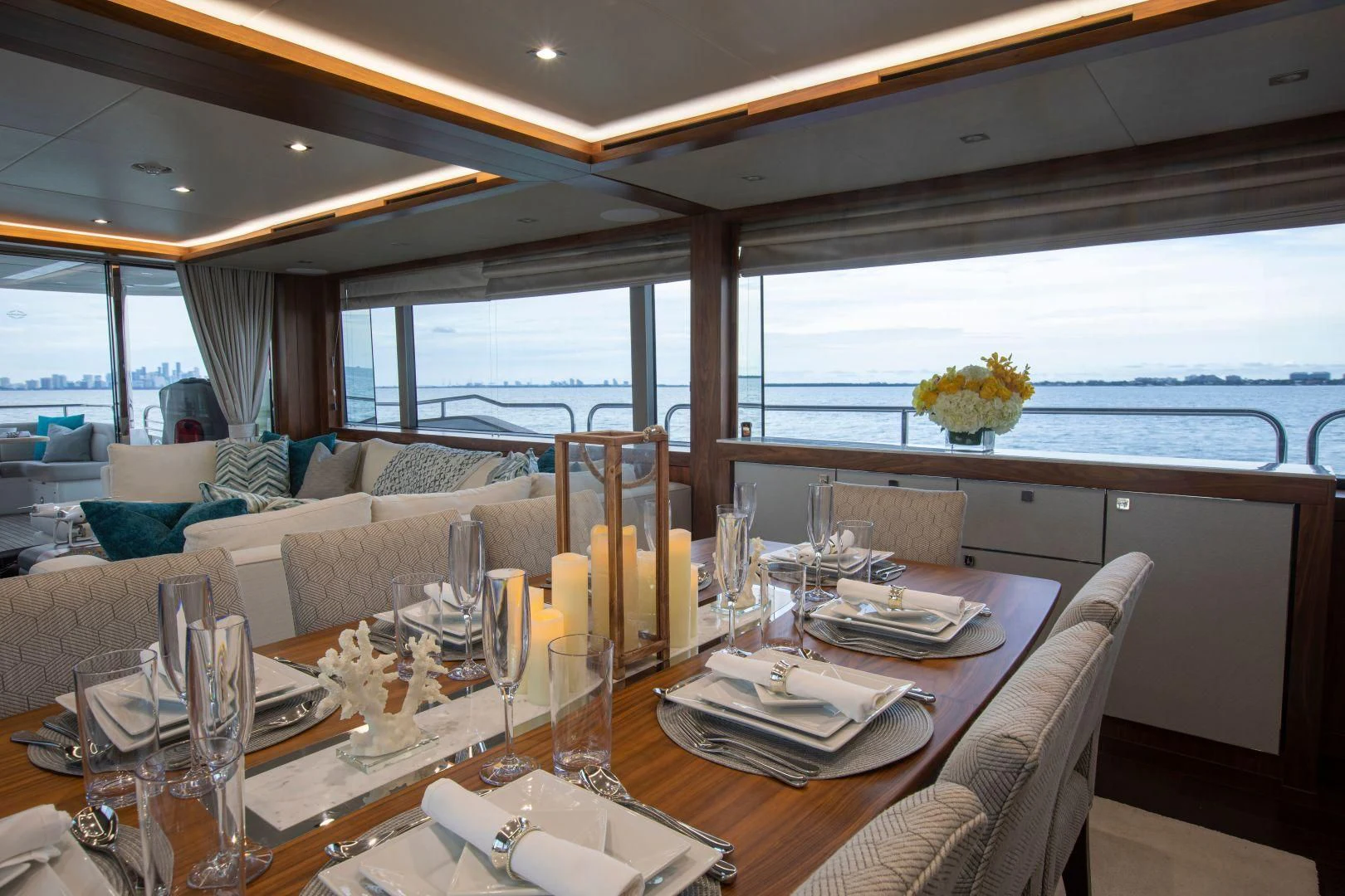 a dining table with wine glasses aboard JUST ONE MORE Yacht for Sale