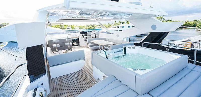 a large white boat on a deck aboard JUST ONE MORE Yacht for Sale