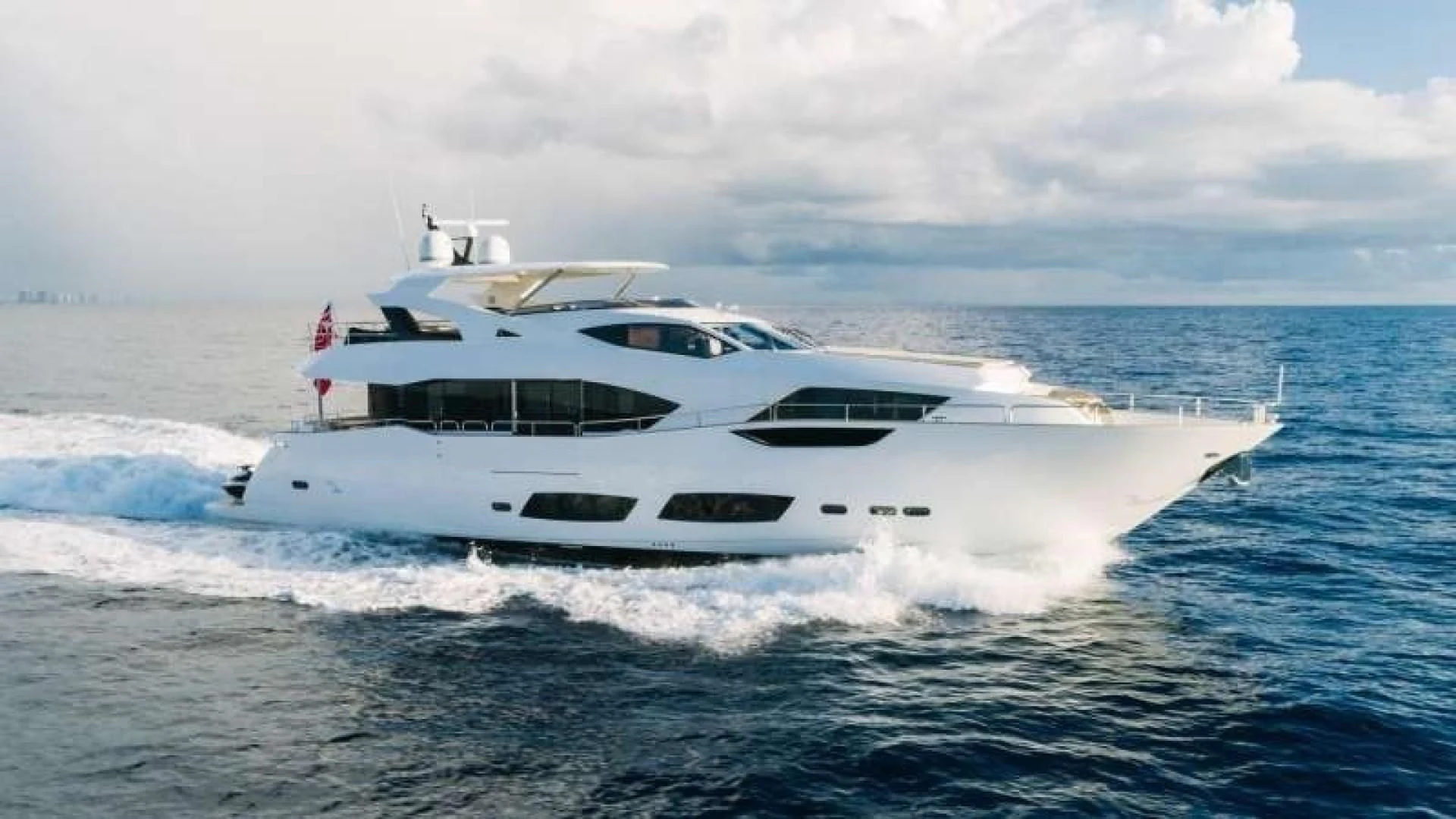a white yacht on the water aboard JUST ONE MORE Yacht for Sale