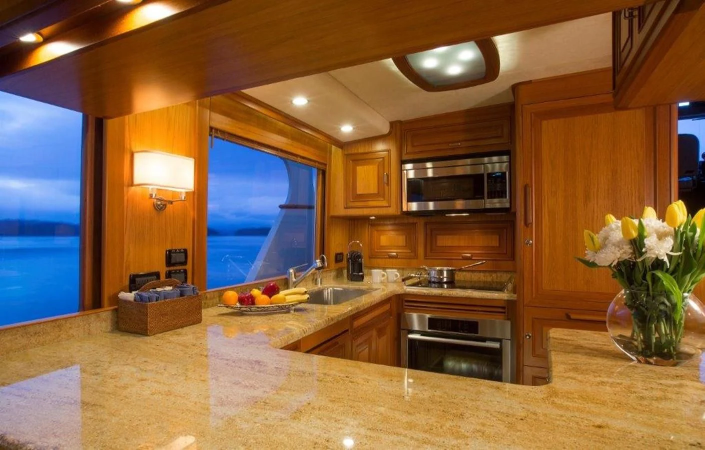 a kitchen with a large island aboard FLEMING 78 - NEW BUILD Yacht for Sale