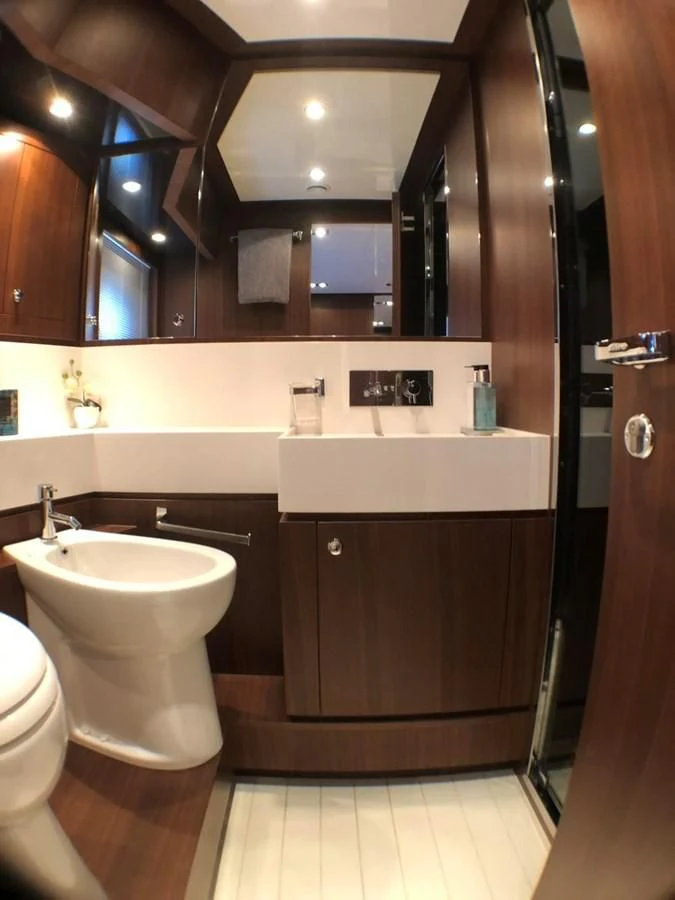 a bathroom with a sink and a mirror aboard MANISCO Yacht for Sale