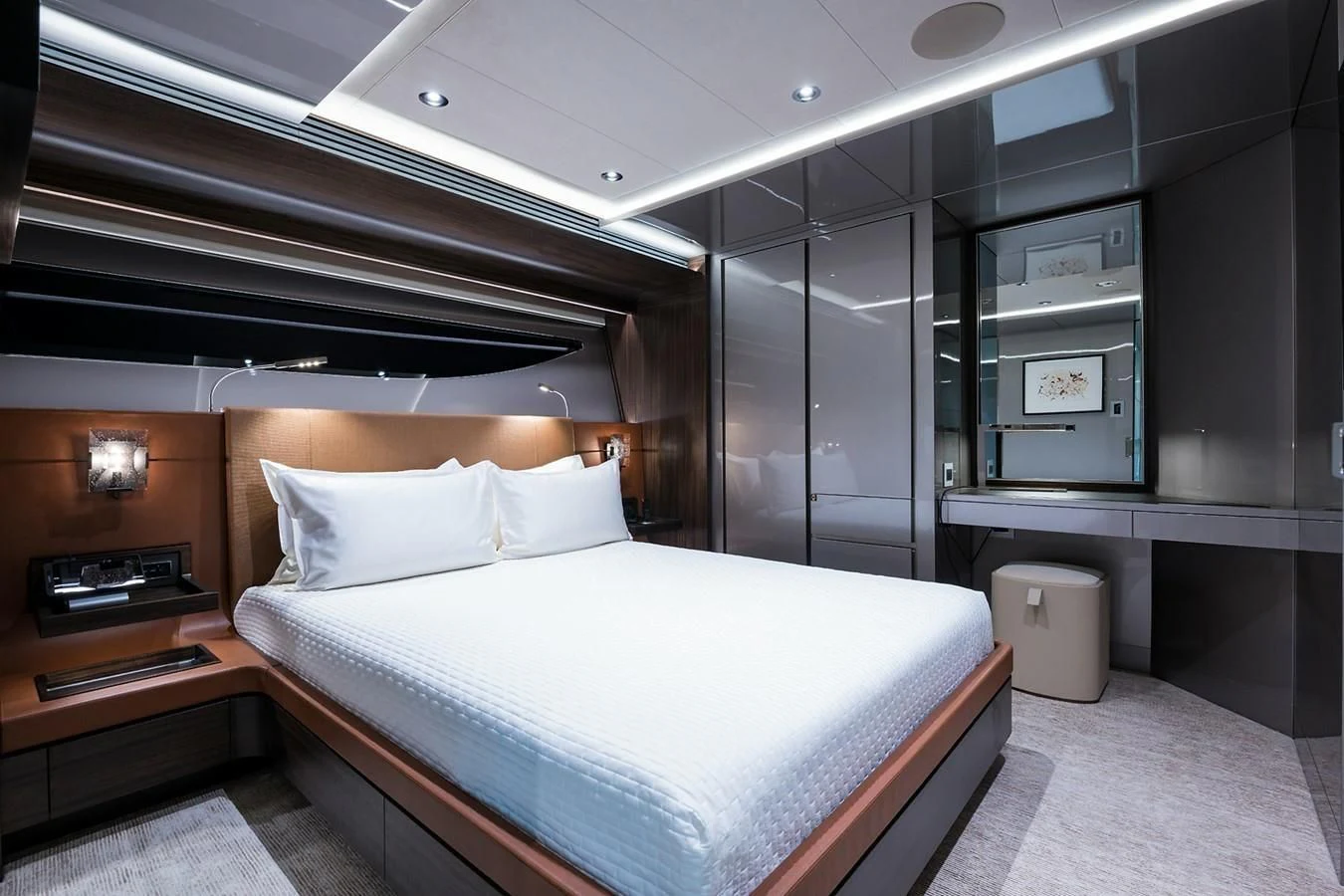 a room with a bed and a desk aboard SERENITY Yacht for Sale