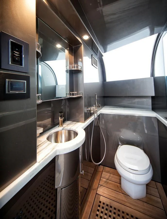 a bathroom with a sink and a toilet aboard SERENITY Yacht for Sale