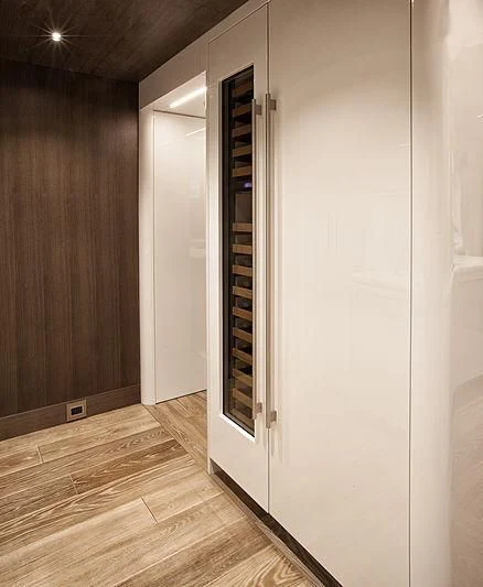 a large white refrigerator aboard SERENITY Yacht for Sale
